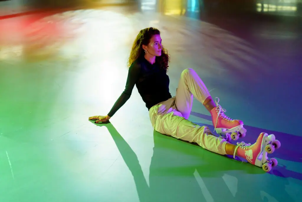 A woman sitting on the ground in a room.